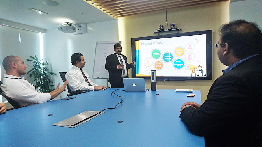 People around video conference table